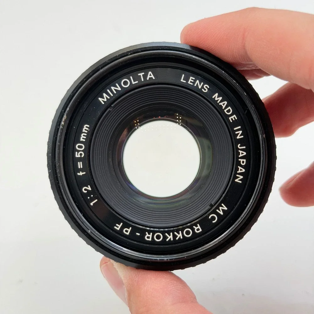 Minolta MC Rokkor-PF 50mm f/2 Lens with 55mm Skylight 1A Hood SR Mount 1126884